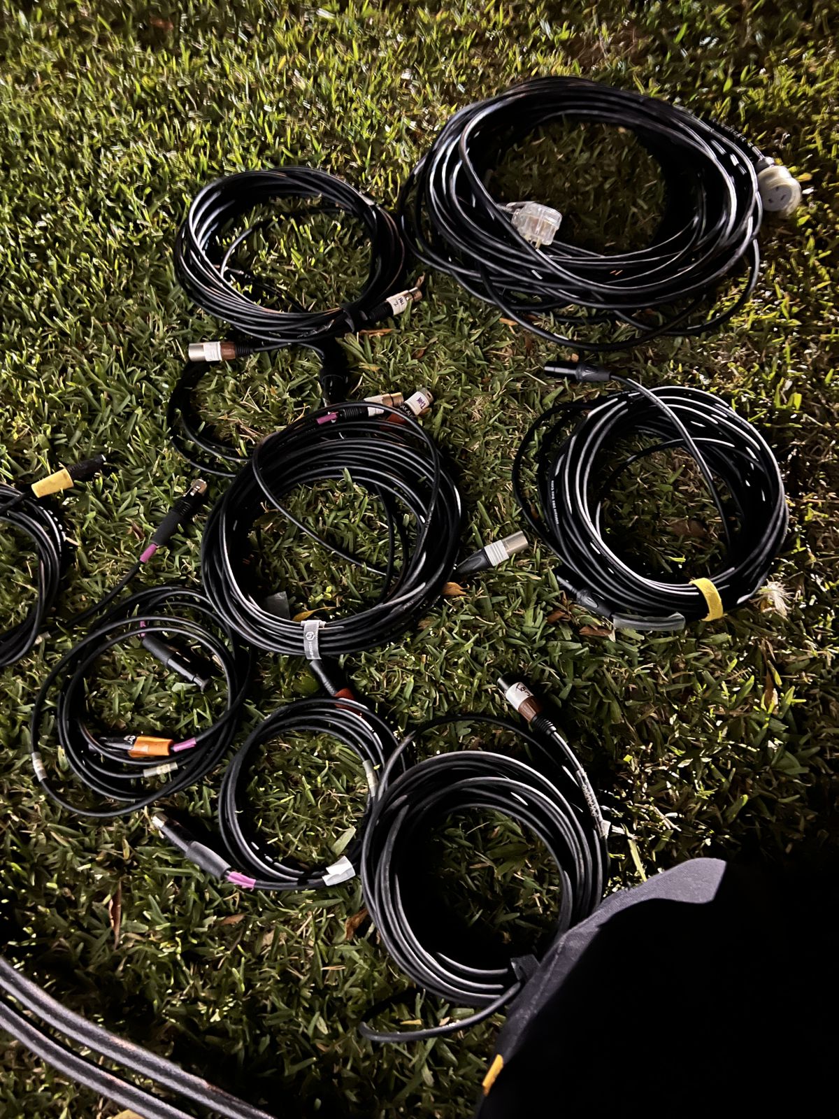 Coiled XLR cable looms ready for a job