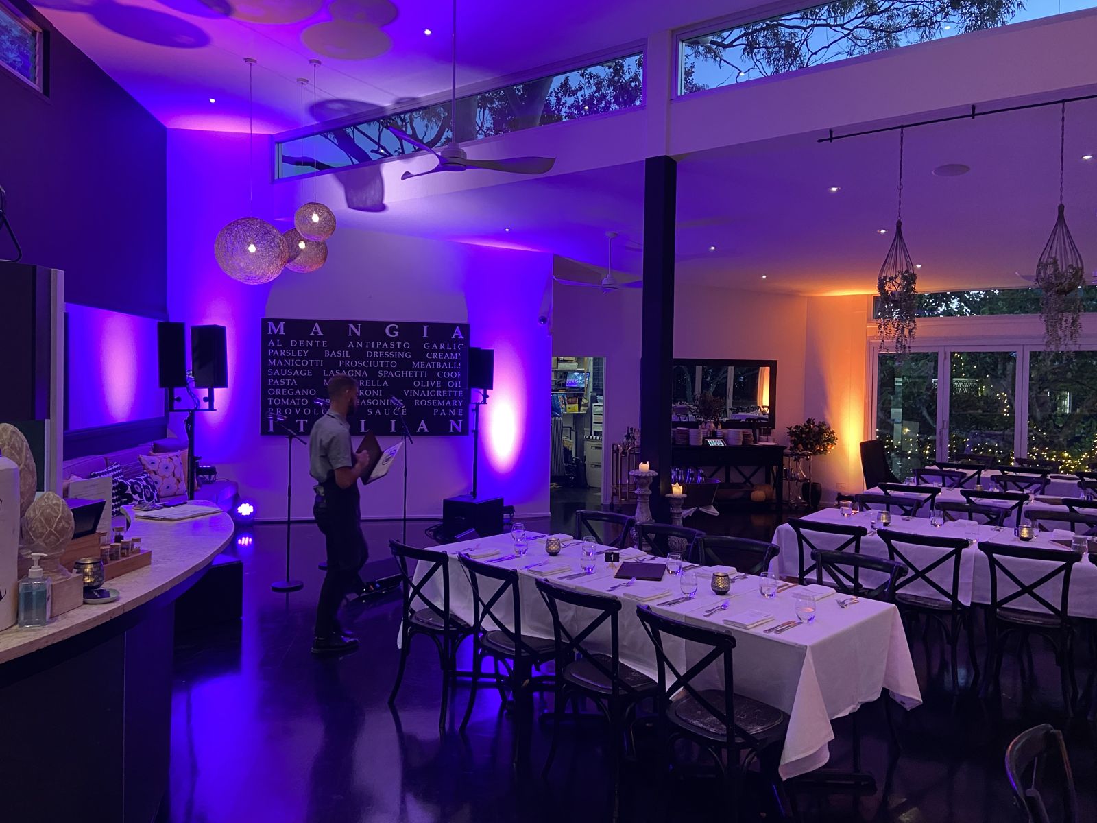 Noosa Waterfront Restaurant set for a dinner show, uplit with no visible cabling