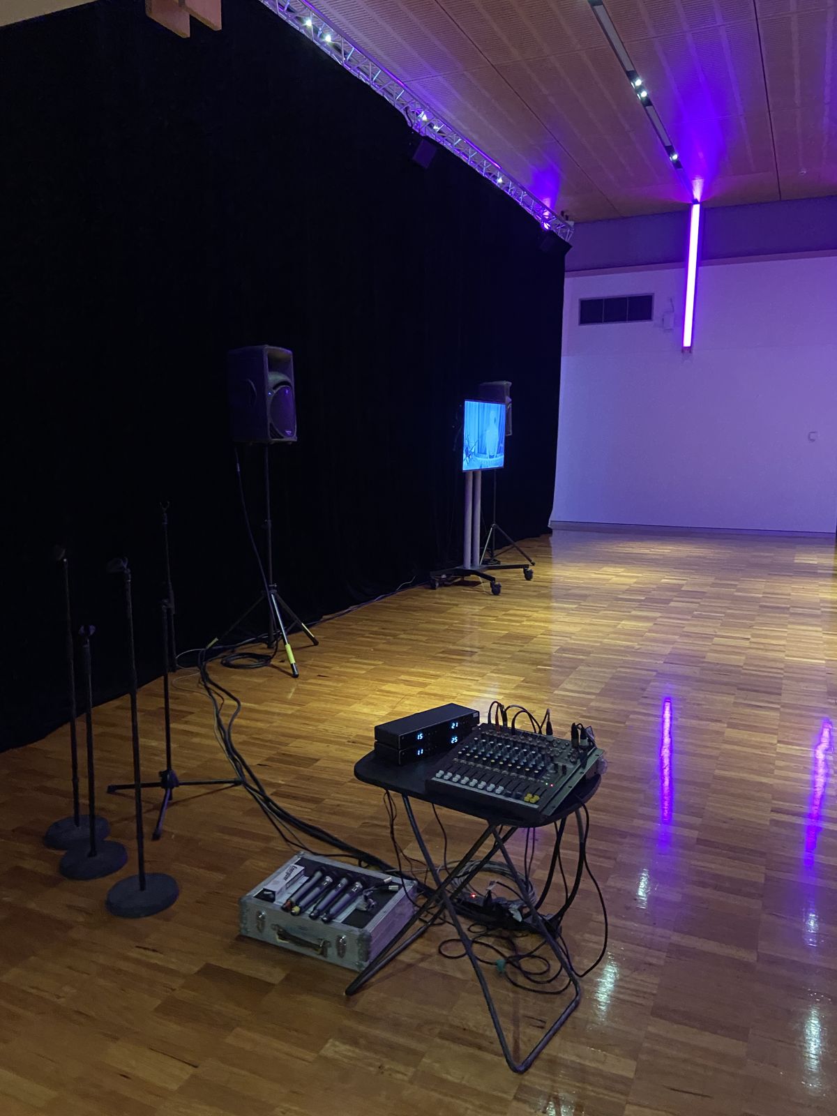Portable PA, mixer and wireless mics set up in a function room