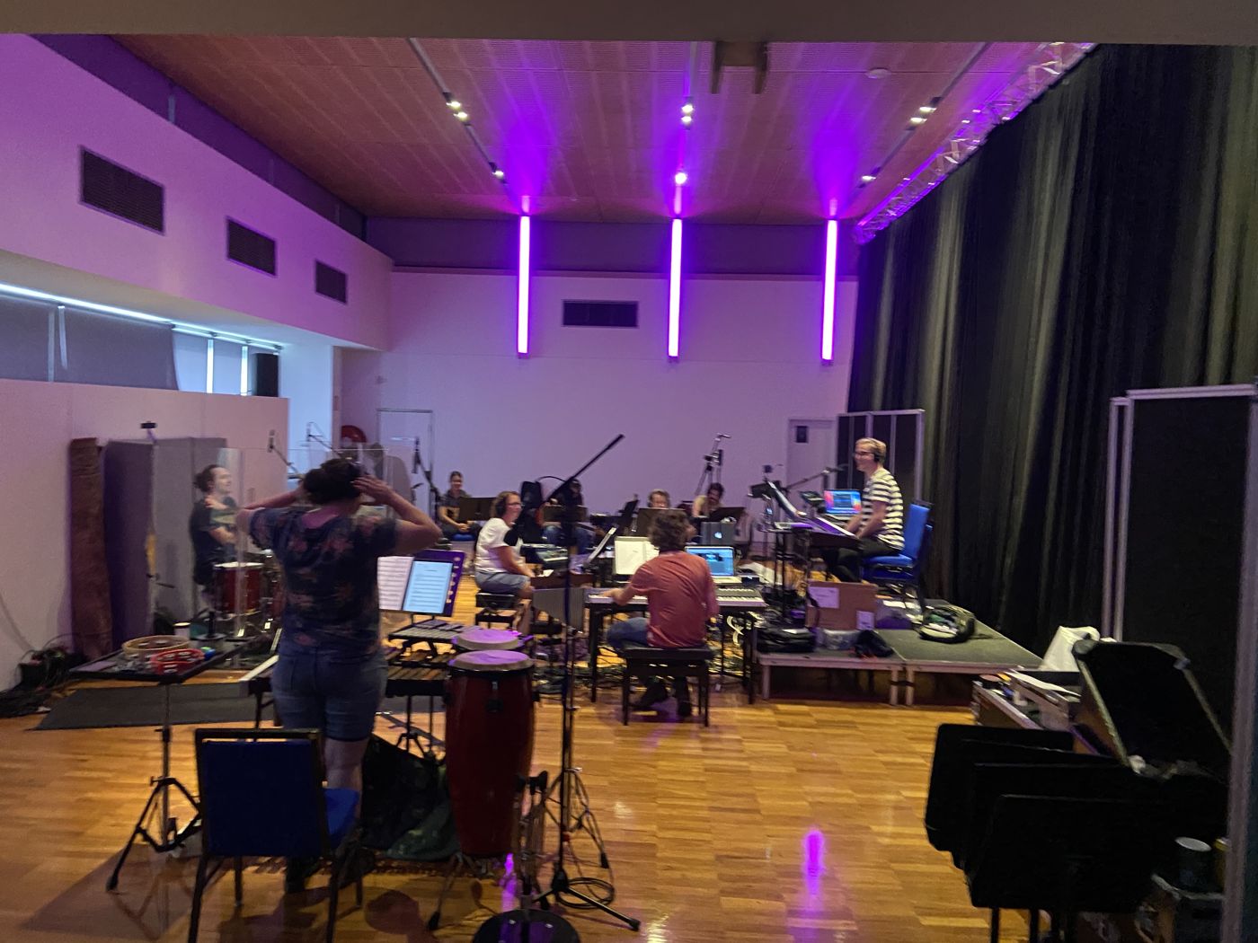 Band and cast rehearsing in a studio space