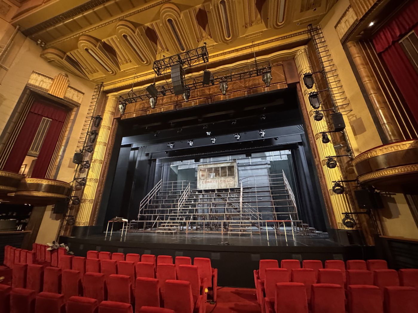 Theatre stage and set seen from the stalls, PA flown above