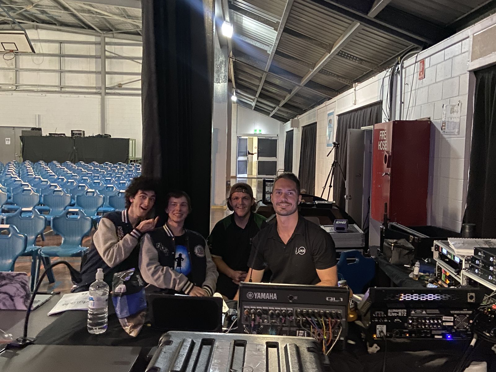 Student sound crew at the desk for a school production of Matilda
